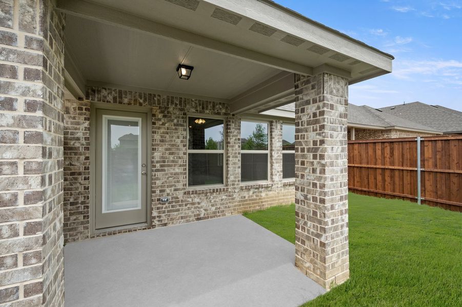 Front exterior of a new home in Redden Farms, Midlothian, TX, highlighting curb appeal (Image 27). Front exterior of a new home in Redden Farms, Midlothian, TX, highlighting curb appeal (Image 27).