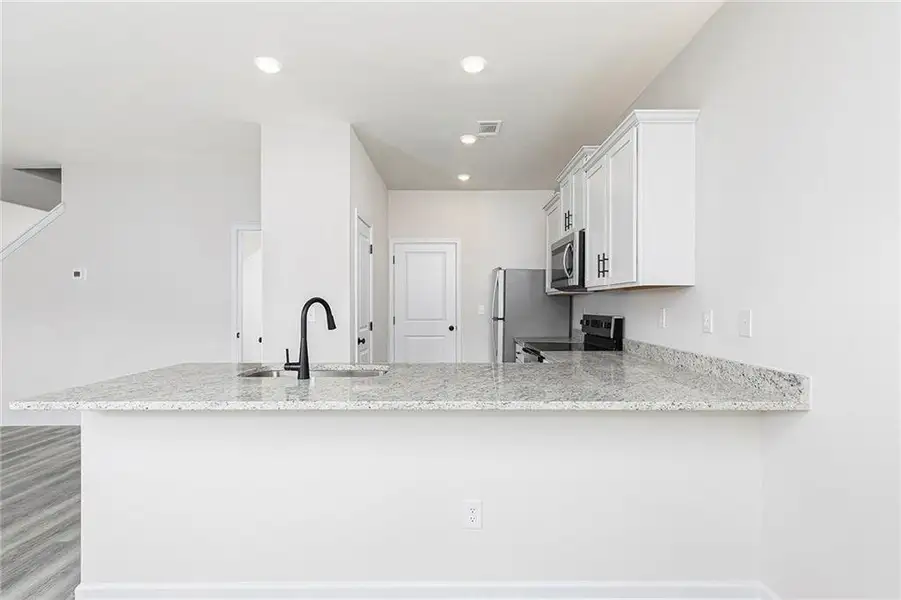 Furnished interior view inside a new home in Lake Preserve at Jackson Trail, Jefferson (Image 8). Furnished interior view inside a new home in Lake Preserve at Jackson Trail, Jefferson (Image 8).