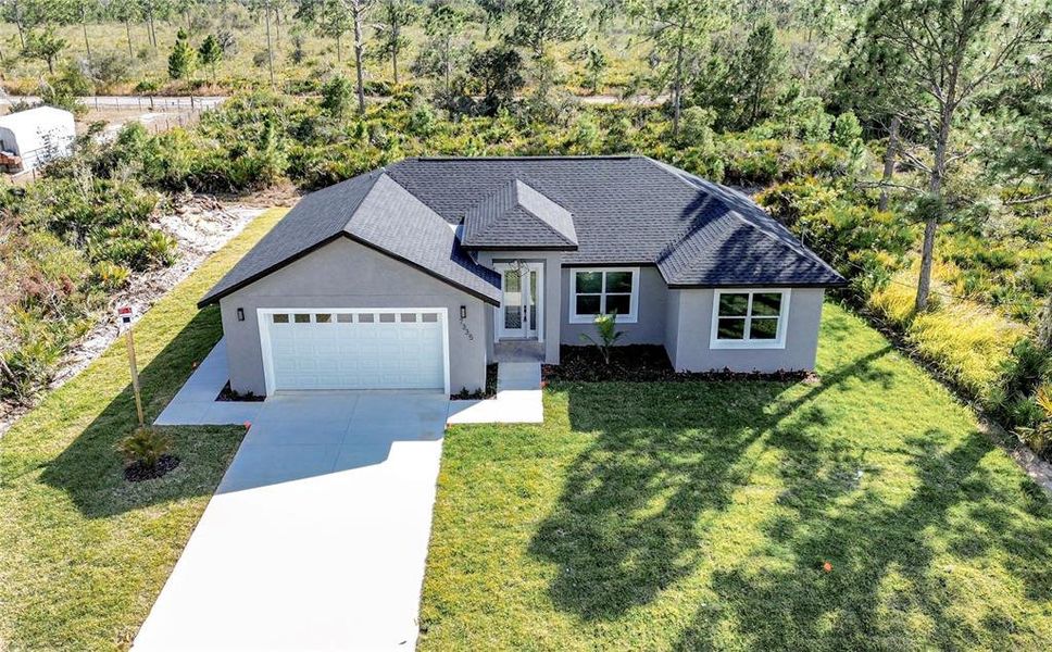 Front exterior of a new home in , Sebring, FL, highlighting curb appeal (Image 2). Front exterior of a new home in , Sebring, FL, highlighting curb appeal (Image 2).