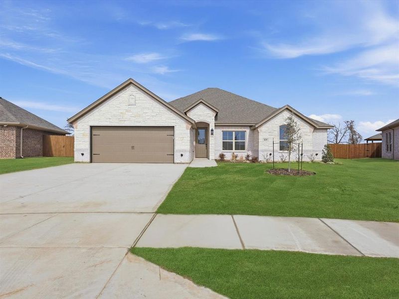 Front exterior of a new home in , Springtown, TX, highlighting curb appeal (Image 2). Front exterior of a new home in , Springtown, TX, highlighting curb appeal (Image 2).