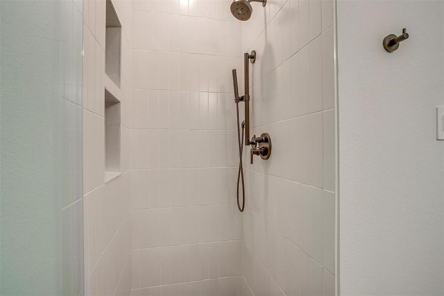 Interior details featuring tiled shower