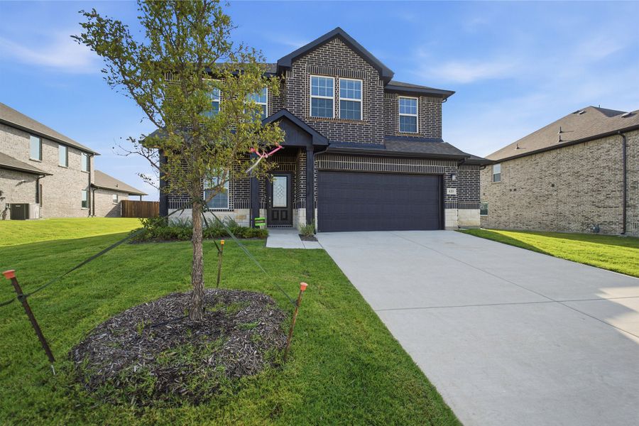 Front exterior of a new home in Saddlebrook Estates, Waxahachie, TX, highlighting curb appeal (Image 19).