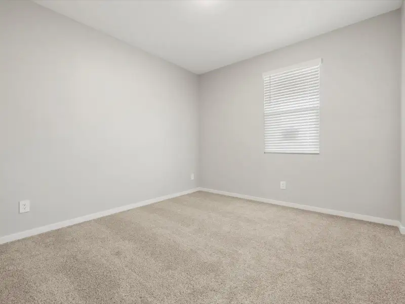 Spacious, unfurnished interior of a new home in Blossom Rock Reserve Series, Apache Junction (Image 13).
