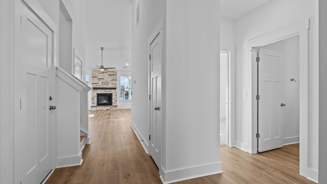 Refined foyer with hardwood floors and thoughtful design for a first-rate welcome