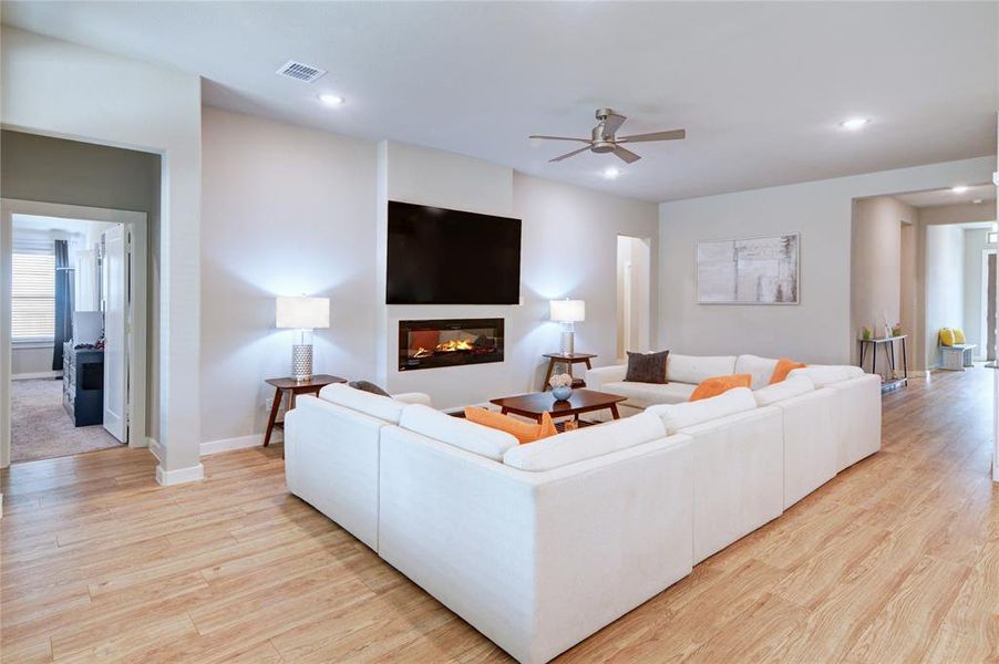 ANOTHER VIEW OF THE LIVING ROOM WITH ELECTRIC FIREPLACE