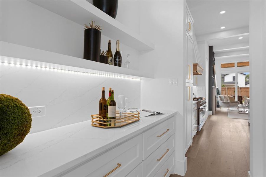 This home has all the extras! Butlers Pantry / Dry Bar between dining room and kitchen is ideal transition space. Plenty of room for small appliances, coffee bar, or display treasured collections. This home has all the extras! Butlers Pantry / Dry Bar between dining room and kitchen is ideal transition space. Plenty of room for small appliances, coffee bar, or display treasured collections.