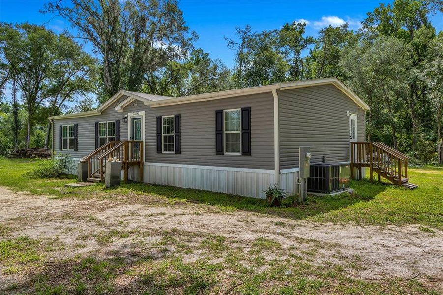 Exterior details and patio area of a home in , Brooksville (Image 21).