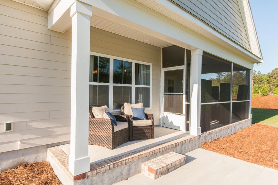 Representative exterior photo of a completed home built from the Helmsley by Bill Clark Homes in The Sanctuary at Sunset Beach, Sunset Beach, NC (Image 28). Representative exterior photo of a completed home built from the Helmsley by Bill Clark Homes in The Sanctuary at Sunset Beach, Sunset Beach, NC (Image 28).