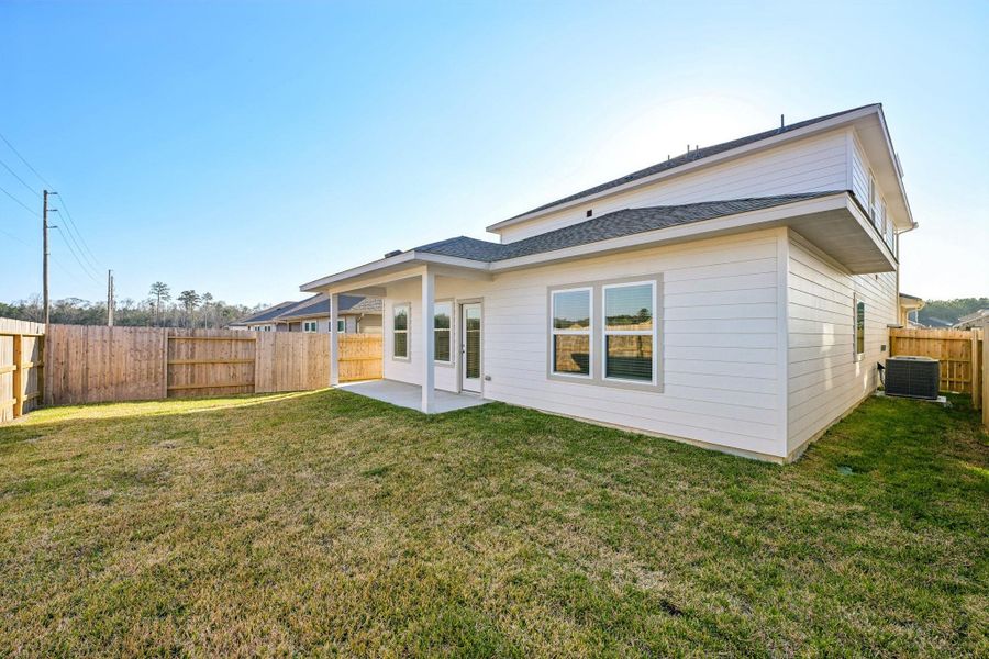 Exterior details and patio area of a home in Landing Meadows - Premier Series, New Caney (Image 23).