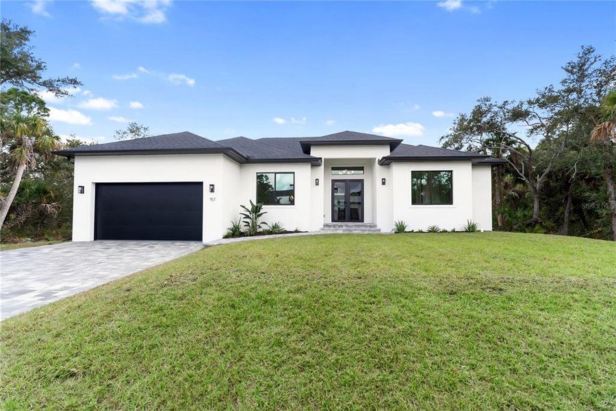 Front exterior of a new home in , Port Charlotte, FL, highlighting curb appeal (Image 32).