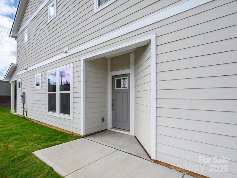 Front exterior of a new home in Westview Towns, Waxhaw, NC, highlighting curb appeal (Image 1).