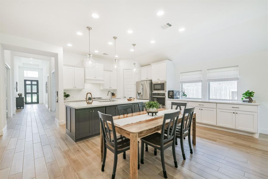 Dining room features a built-in buffet and custom shades. Dining room features a built-in buffet and custom shades.