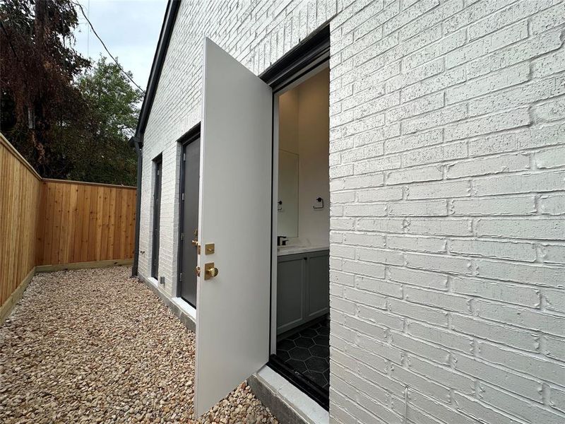 Cabana bath (1/2 bath) located on back side of patio