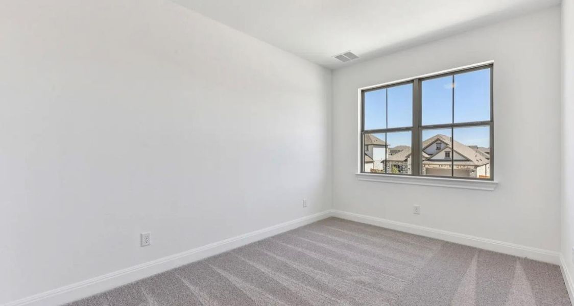 Spacious, unfurnished interior of a new home in 6 Creeks, Kyle (Image 14).