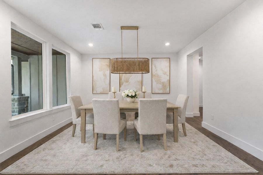 Digitally staged for inspiration, this elegant dining room features a modern chandelier, neutral tones, and stylish décor, creating a welcoming ambiance perfect for entertaining.