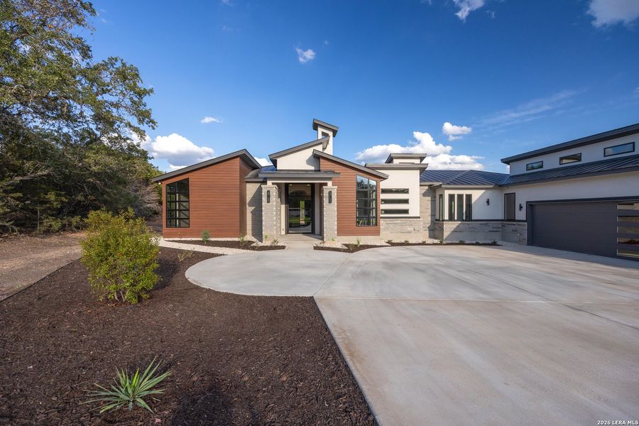 Front exterior of a new home in , Canyon Lake, TX, highlighting curb appeal (Image 2). Front exterior of a new home in , Canyon Lake, TX, highlighting curb appeal (Image 2).