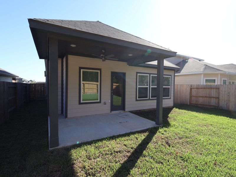 Exterior details and patio area of a home in Pinewood at Grand Texas, New Caney (Image 2). Exterior details and patio area of a home in Pinewood at Grand Texas, New Caney (Image 2).