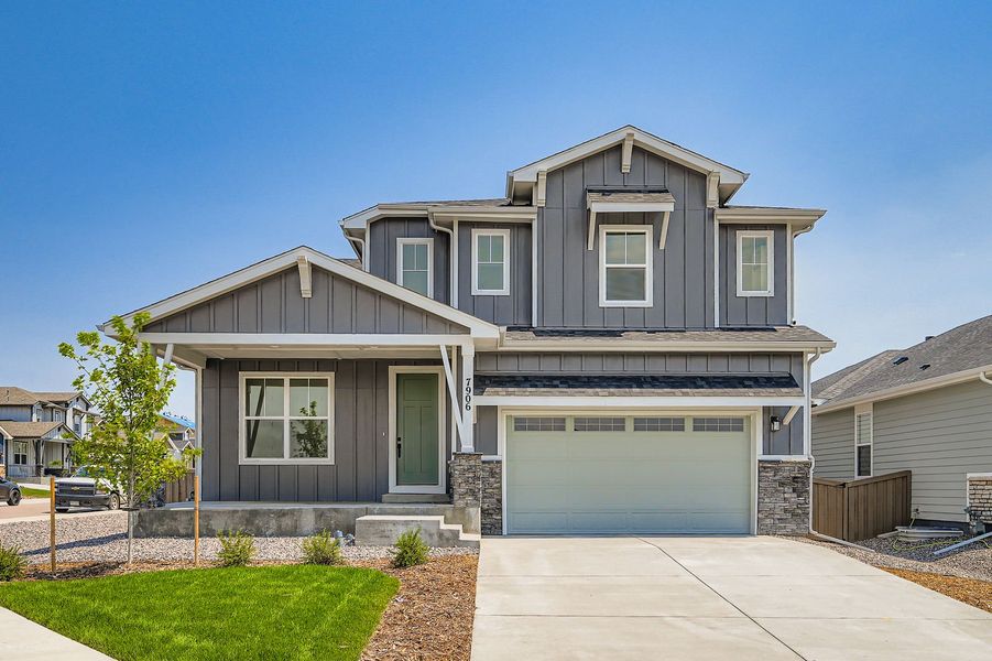 Front exterior of a new home in Sterling Ranch 50s, Colorado Springs, CO, highlighting curb appeal (Image 1).