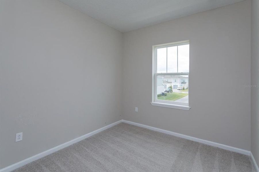 Spacious, unfurnished interior of a new home in Serenade at Ovation, Winter Garden (Image 22).
