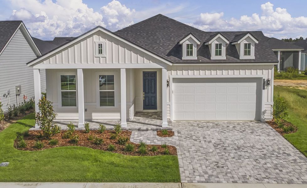 Front exterior of a new home in Oakmont, Gainesville, FL, highlighting curb appeal (Image 1).