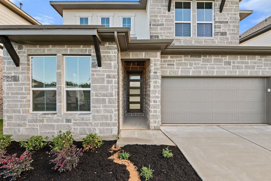 Exterior details and patio area of a home in Heritage, Dripping Springs (Image 24).