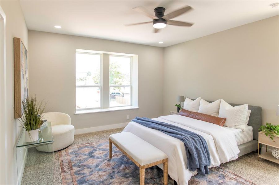 Carpeted bedroom with ceiling fan