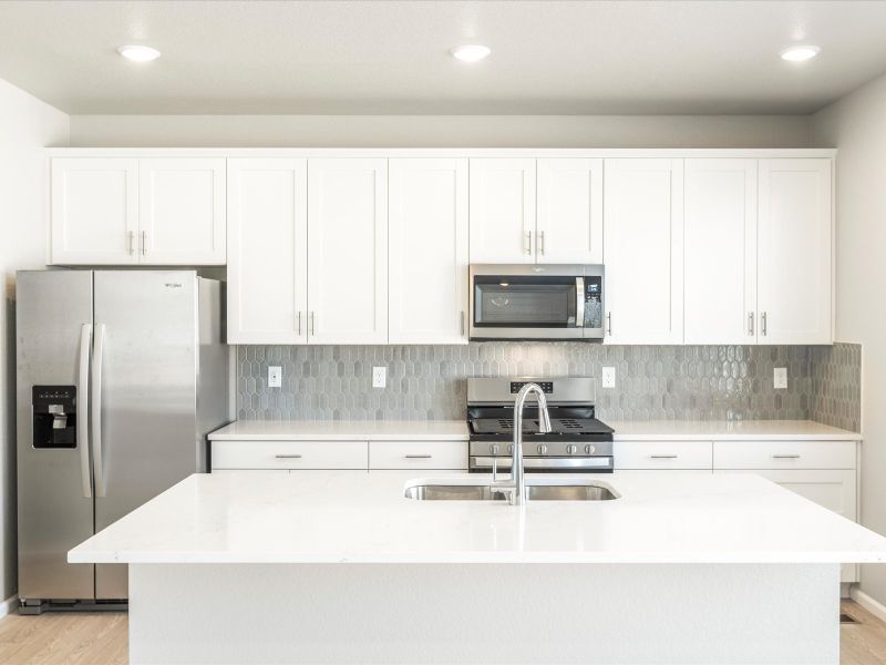 Kitchen in the Wateron floorplan at a Meritage Homes community in Brighton, CO.