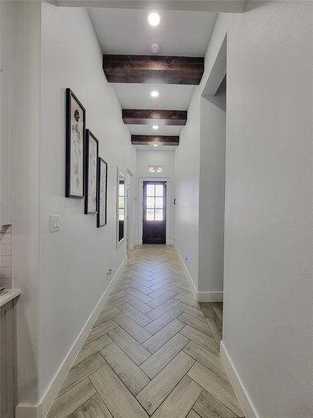Doorway to outside with recessed lighting, beamed ceiling, and parquet flooring