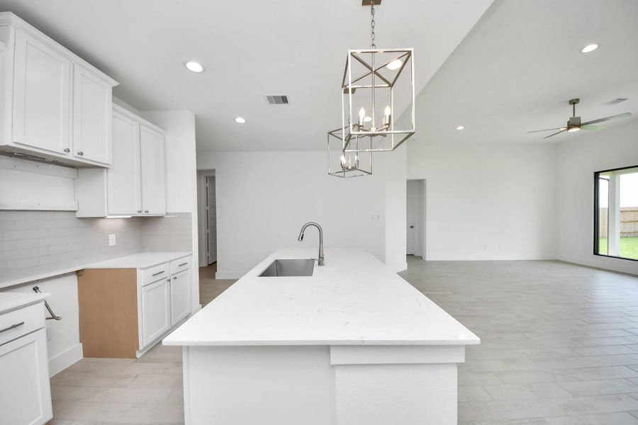 The extended counter area adds both practicality and style, making meal preparation a breeze. Every detail is thoughtfully designed to enhance the kitchen's functionality and aesthetic appeal.