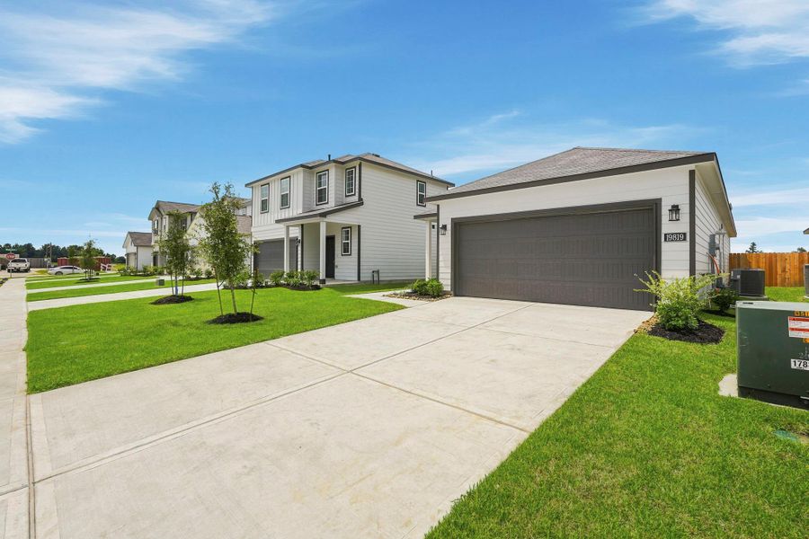 Front exterior of a new home in Northpark South, Porter, TX, highlighting curb appeal (Image 18).