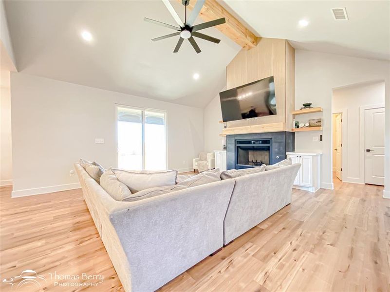 Oversized living space large enough for full-size sectional couch with abundant natural light.