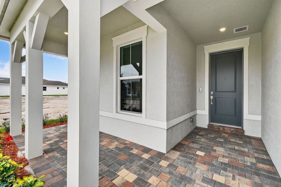Exterior details and patio area of a home in Del Webb Tradition, Port St. Lucie (Image 35).
