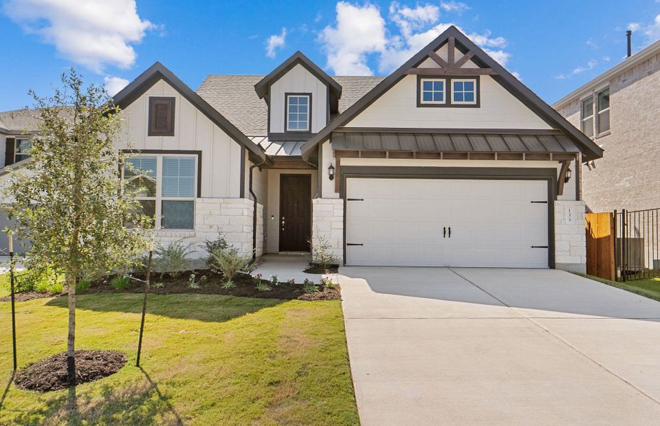 Front exterior of a new home in Saddleback at Santa Rita Ranch, Liberty Hill, TX, highlighting curb appeal (Image 21). Front exterior of a new home in Saddleback at Santa Rita Ranch, Liberty Hill, TX, highlighting curb appeal (Image 21).