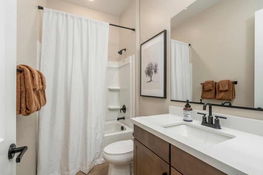 Representative furnished interior of a home built from the Falcon by Risewell Homes in Citrus Park, Goodyear (Image 13).