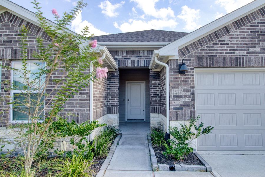 Front exterior of a new home in Central Park, Texas City, TX, highlighting curb appeal (Image 15). Front exterior of a new home in Central Park, Texas City, TX, highlighting curb appeal (Image 15).