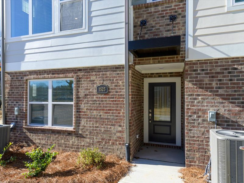 Exterior details and patio area of a home in Central Living at Craig, Charlotte (Image 3).