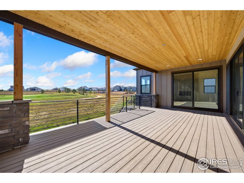 Exterior details and patio area of a home in The Fairways at RainDance, Windsor (Image 3).