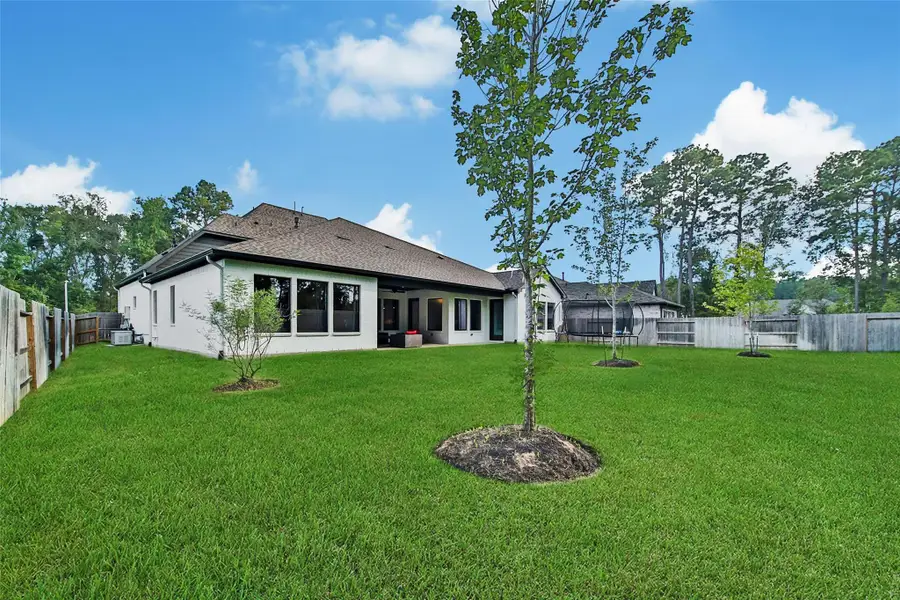 Exterior details and patio area of a home in ARTAVIA, Conroe (Image 3).