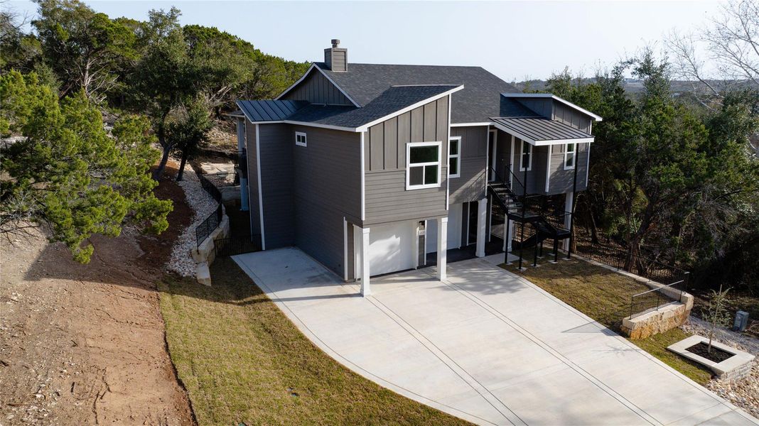 Front view of home w/stairway, and board and batten siding Front view of home w/stairway, and board and batten siding