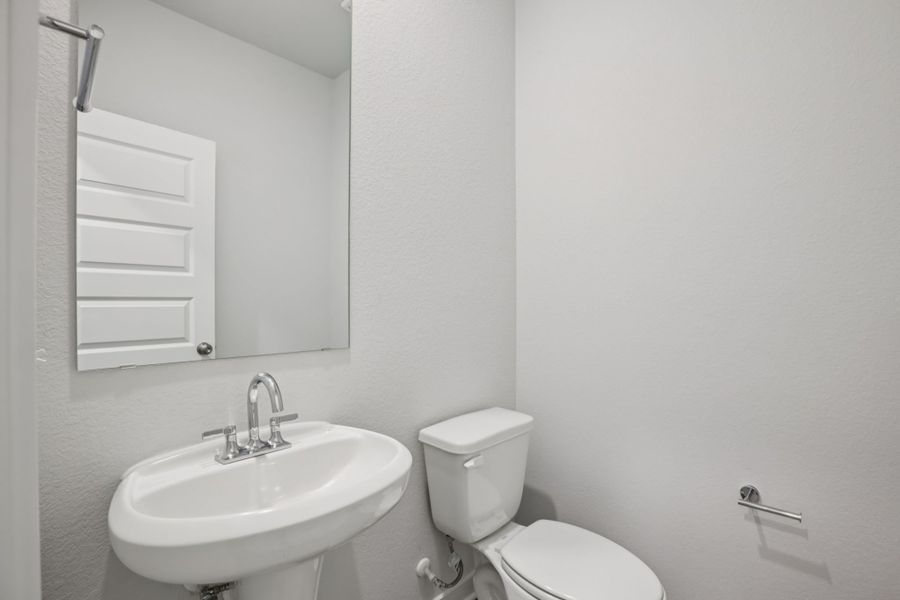 A bathroom with a sink and toilet.
