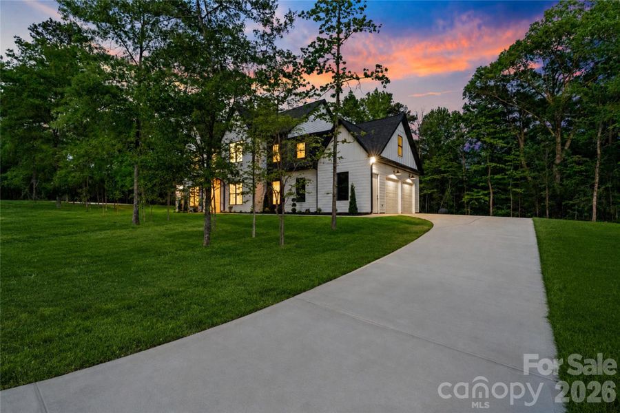 Front exterior of a new home in , Clover, SC, highlighting curb appeal (Image 26).