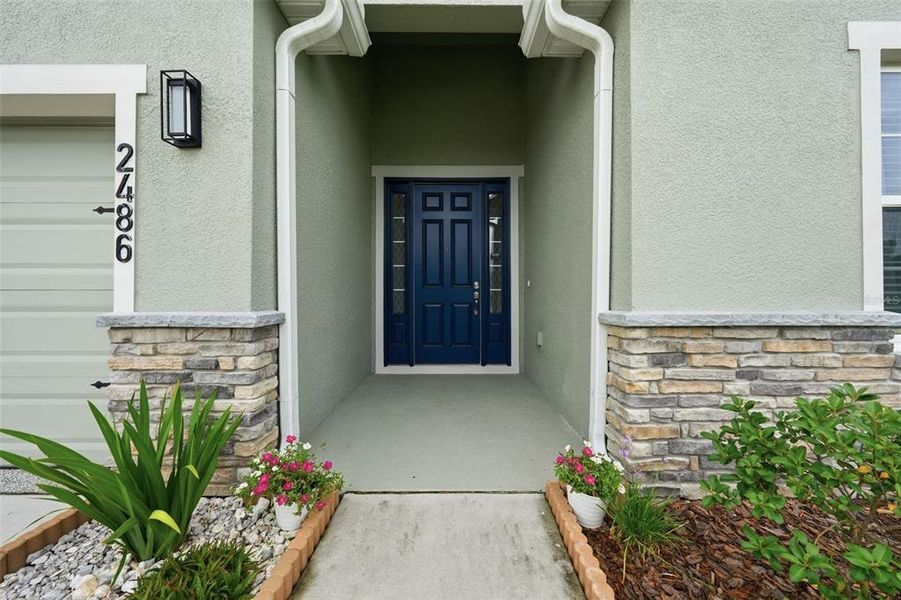 Exterior details and patio area of a home in Geneva Landings, Davenport (Image 26).
