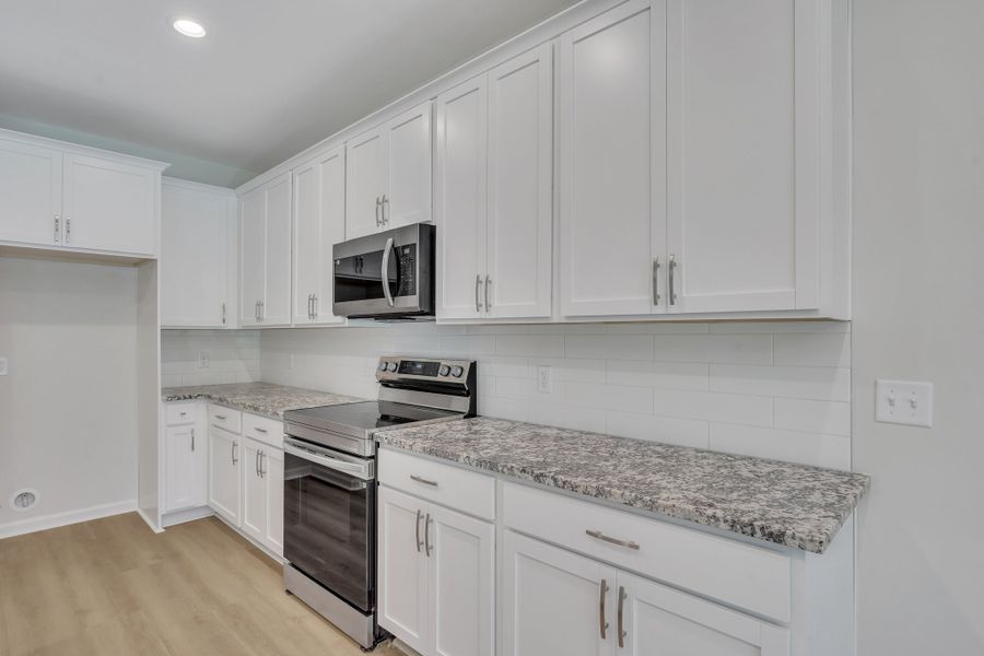 Representative furnished interior of a home built from the The Hatteras by Smith Family Homes in Ramsey Landing, Rincon (Image 8).