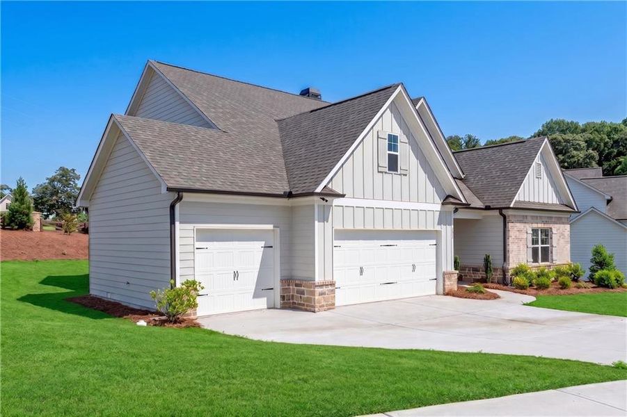 Front exterior of a new home in Hidden Fields, Hoschton, GA, highlighting curb appeal (Image 17).