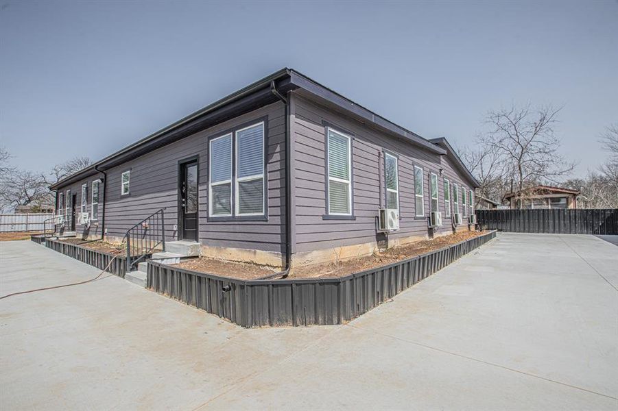 View of home's exterior featuring fence