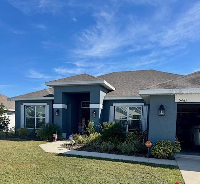 Front exterior of a new home in Knights Landing, Lakeland, FL, highlighting curb appeal (Image 1).