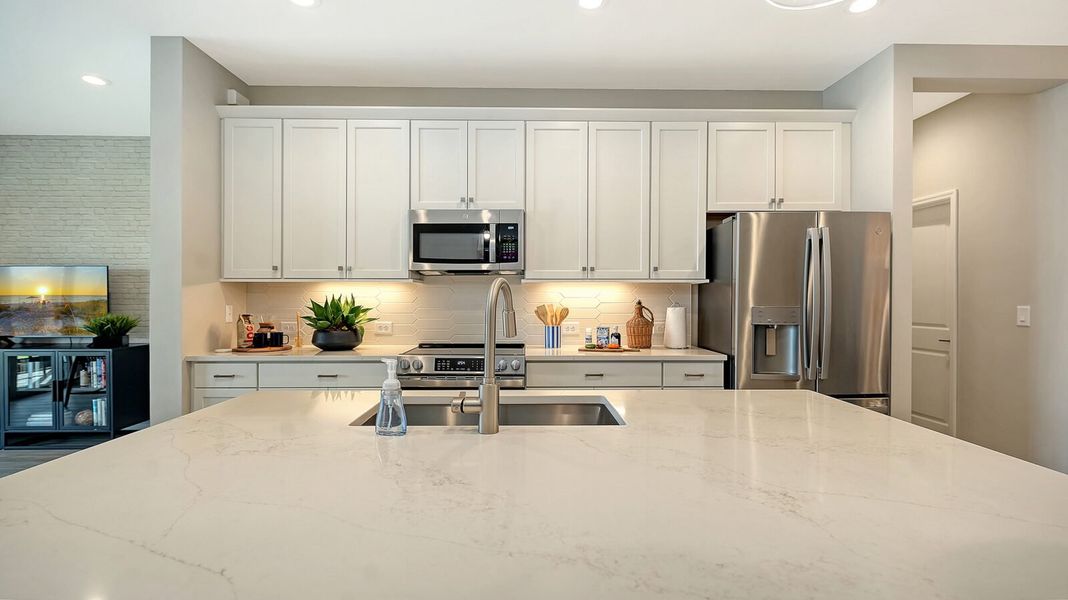 Representative furnished interior of a home built from the Avery by Neal Communities in SkySail, Naples (Image 11).