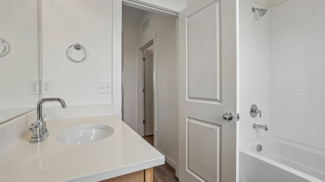 Secondary bathroom with vanity, tub and shower combination, and quality finishes. Secondary bathroom with vanity, tub and shower combination, and quality finishes.