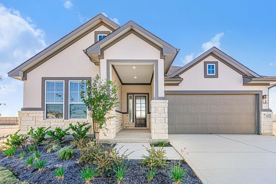 Front exterior of a new home in The Grove at Blackhawk, Pflugerville, TX, highlighting curb appeal (Image 28). Front exterior of a new home in The Grove at Blackhawk, Pflugerville, TX, highlighting curb appeal (Image 28).