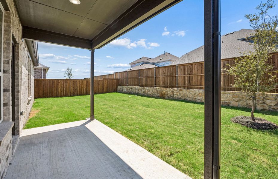 Exterior details and patio area of a home in Creekview Meadows, Pilot Point (Image 2).
